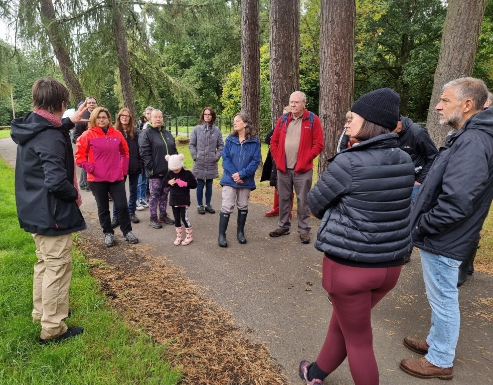 Anna talking to the group in the park
